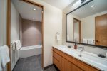 Lavish bathroom with steam shower and/or soaker tub